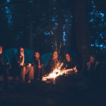 group of people making campfires to increase collaboration