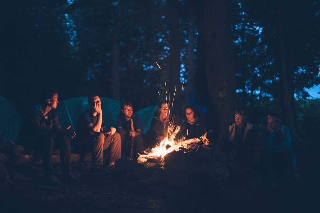 group of people making campfires to increase collaboration