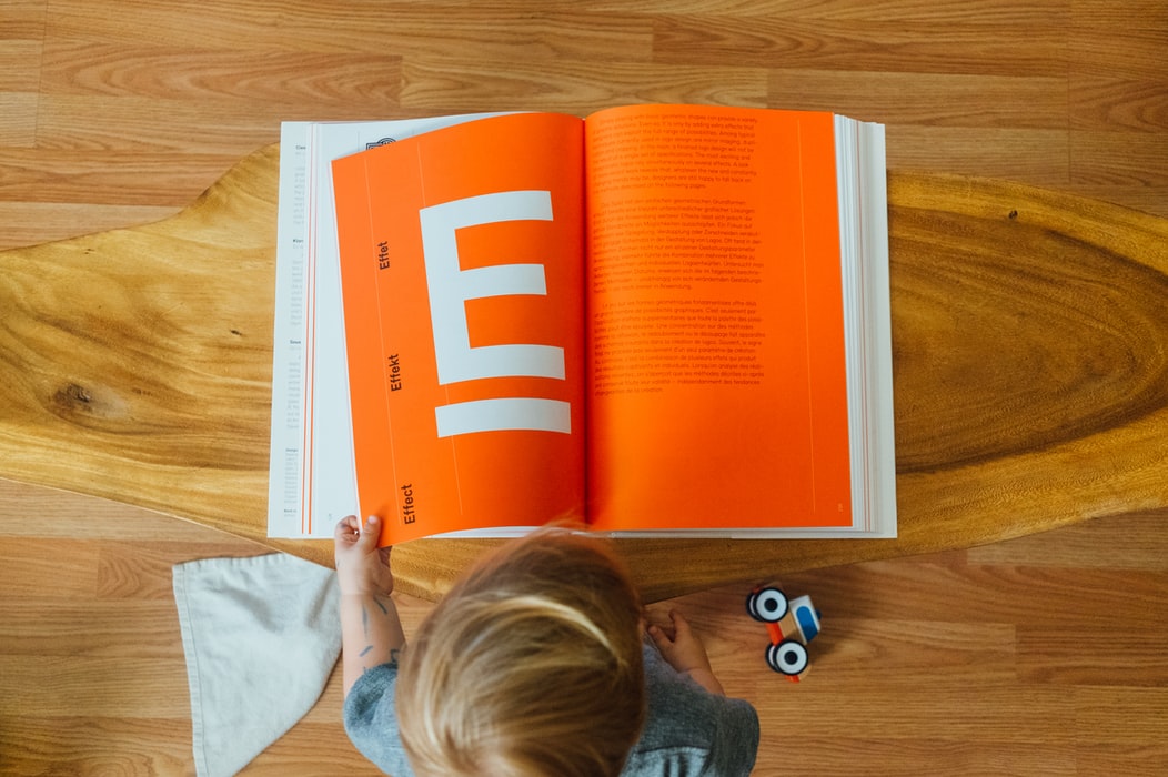 a child is reading a book